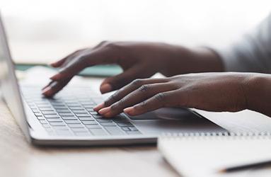 person typing on keyboard